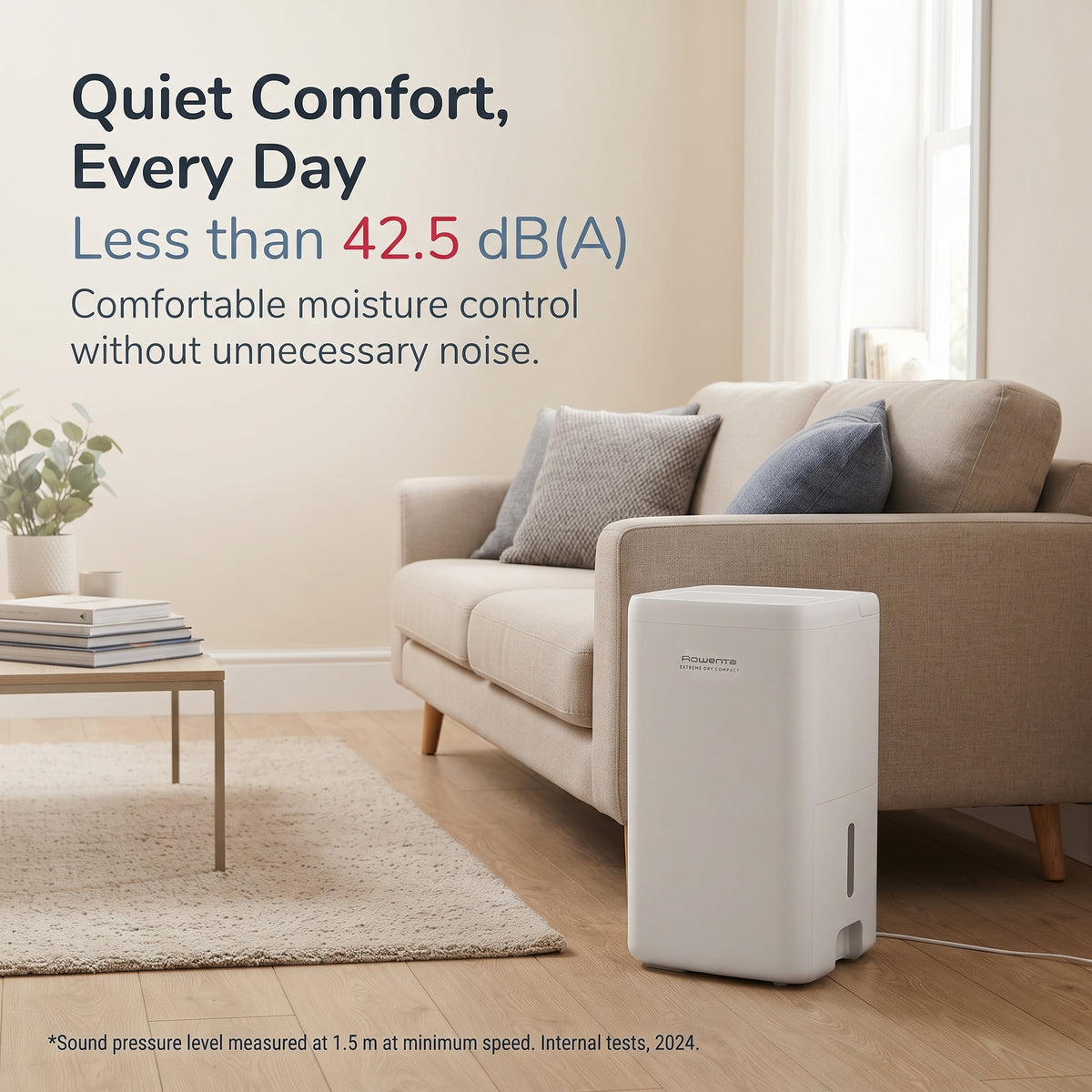 Quiet 14L portable dehumidifier operating under 42.5 dB in a living room for low-noise home moisture control.