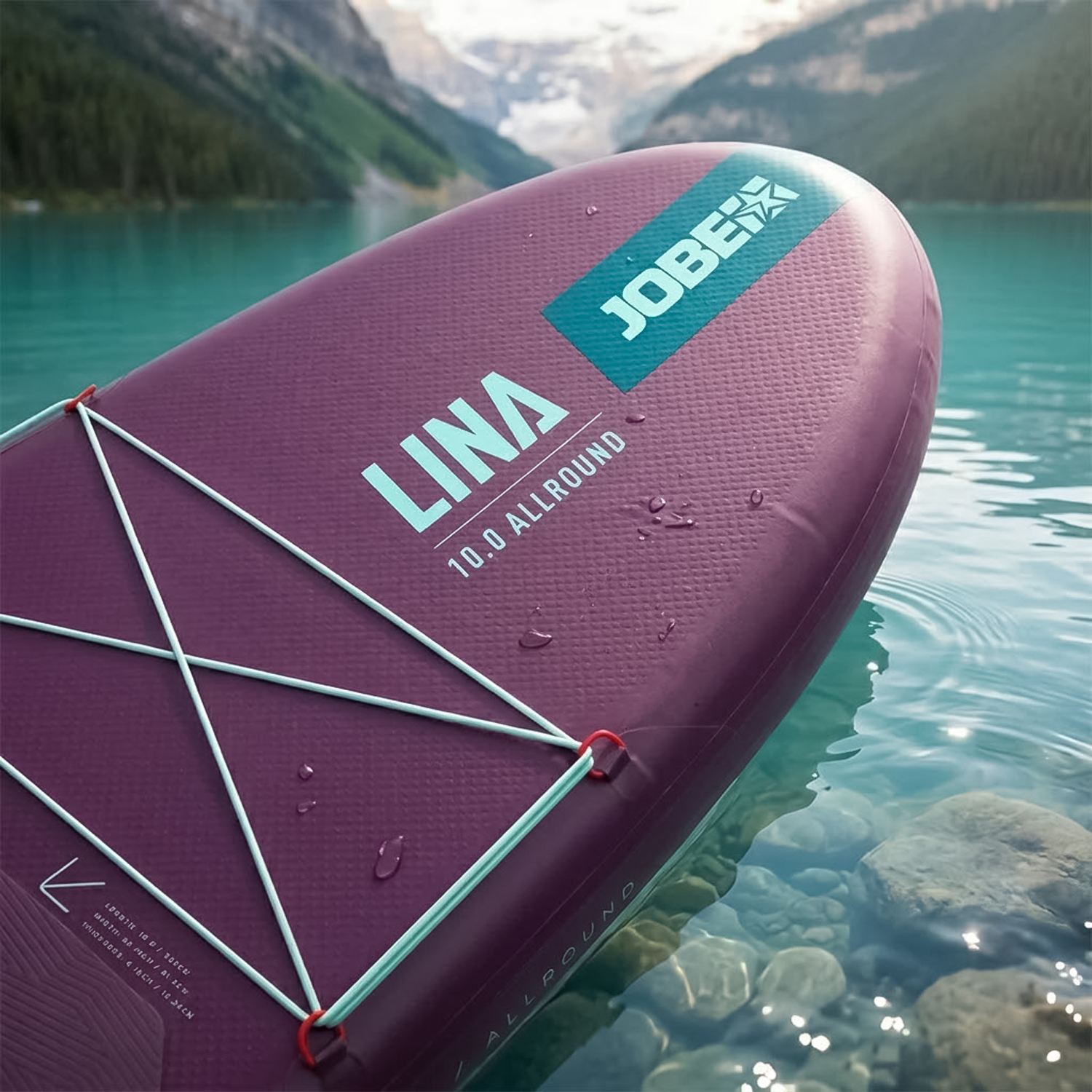 Close-up view of front bungee storage system on purple stand up paddle board