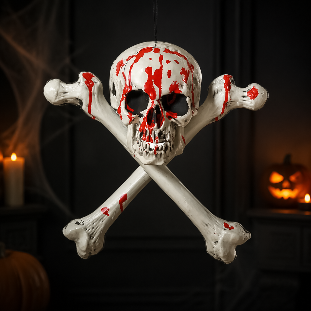 Hanging bloody skull and crossbones halloween prop suspended against dark spooky backdrop