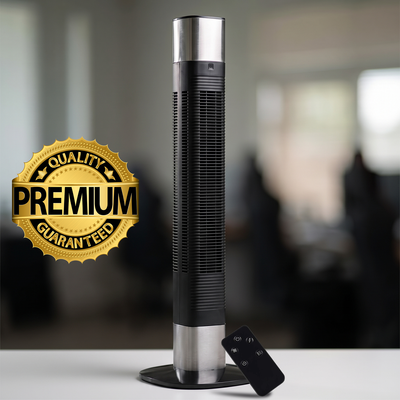 Black and silver bladeless tower fan standing on a tabletop next to its remote control
