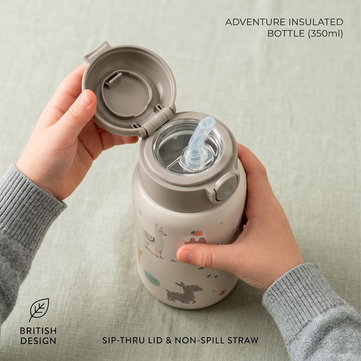 child holding straw bottle top view